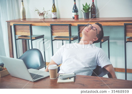 businessman resting on chair after tired from work 35468939