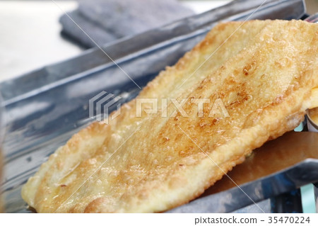 Making of dessert sweet roti 35470224