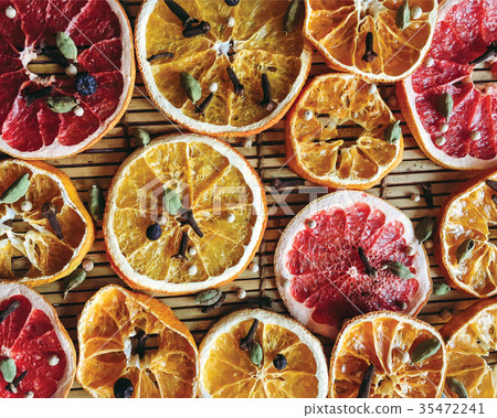 Dried slices of citrus fruits background, orange 35472241