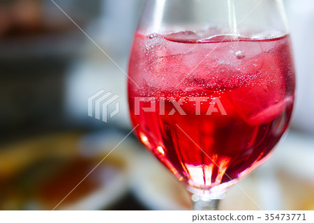 Glass of wine on table at the lunch time Glass of wine on table at the lunch time 35473771