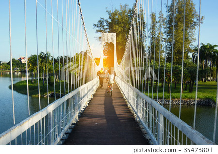 People on the bridge at public park in evening People on the bridge at public park in evening 35473801