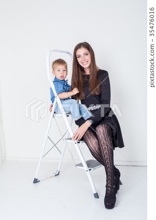 mother and young son on the stairs stepladder 35476016