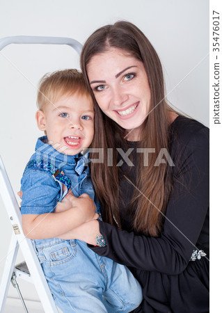 mother and young son on the stairs stepladder 35476017