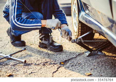 raises the car on a Jack raises the car on a Jack 35478764