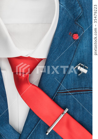 Men's fashion. Elegant denim jacket with a red tie Men's fashion. Elegant denim jacket with a red tie 35479223