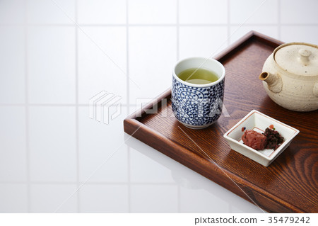 Morning tea and pickled plums 35479242