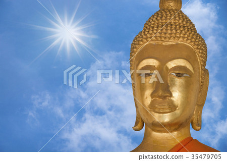 close up face of buddha with blue sky background close up face of buddha with blue sky background 35479705