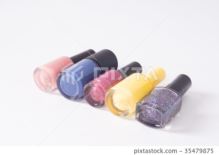 many colored bottles of nail polish in a row 35479875