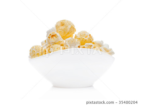Popcorn salty sweet snack in white bowl Popcorn salty sweet snack in white bowl 35480204