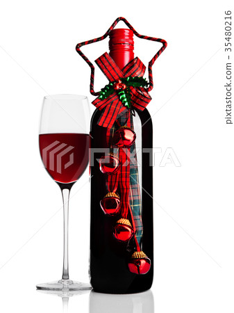 Glass of red wine with bottle and christmas theme 35480216