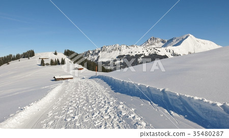 Winter hiking path with beautiful mountain view.  35480287