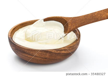 Sour cream in wooden bowl isolated on white 35480327
