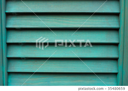 Cyan window with wooden shutter. Cyan window with wooden shutter. 35480659