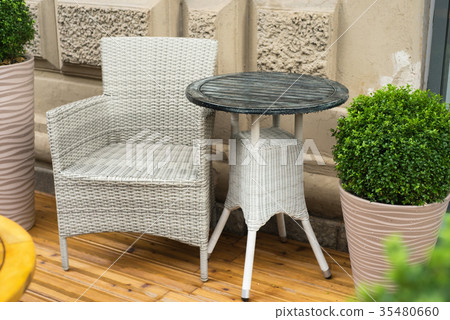 A tables and many chairs on a terrace A tables and many chairs on a terrace 35480660