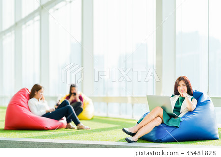 Asian women using laptop, tablet, and smartphone 35481828