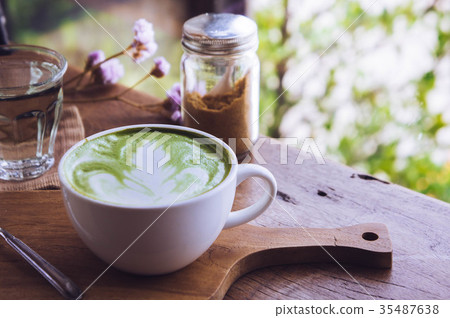 green tea hot drink latte white cup on wood table green tea hot drink latte white cup on wood table 35487638