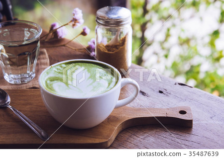 green tea hot drink latte white cup on wood table green tea hot drink latte white cup on wood table 35487639