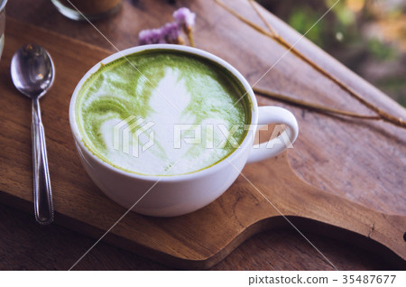 green tea hot drink latte white cup on wood table green tea hot drink latte white cup on wood table 35487677