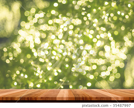 Empty brown wood table with blur christmas light Empty brown wood table with blur christmas light 35487997