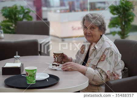 Portrait of old smiling woman in the cafe Portrait of old smiling woman in the cafe 35488357