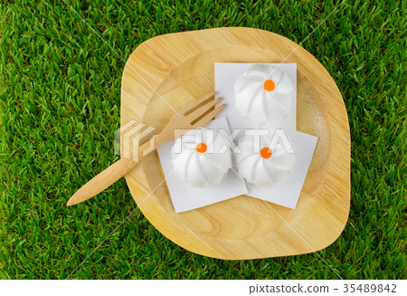 Coin folding with Ribbon is shaped a stream buns  35489842