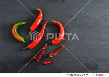 Chilli peppers - fresh peppers and dried pods Chilli peppers - fresh peppers and dried pods 35490083