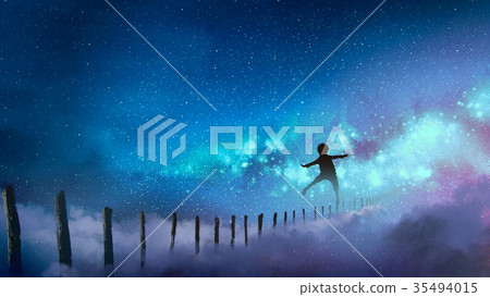 boy balancing on wood sticks against the Milky way 35494015