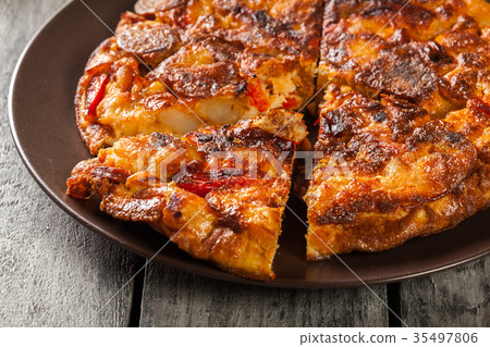 Tortilla de patatas. Spanish omelette with chorizo Tortilla de patatas. Spanish omelette with chorizo 35497806