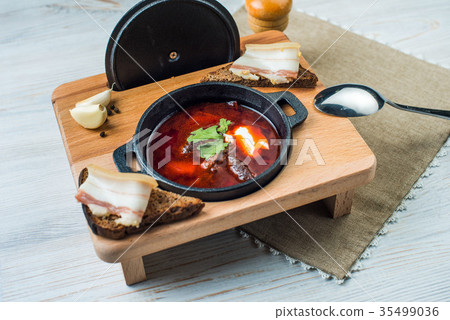 Borscht-beet soup in a cast iron bowl ,a 35499036