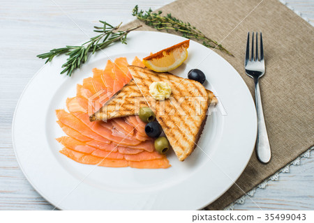 Smoked salmon with fresh dill on bread slice, in 35499043