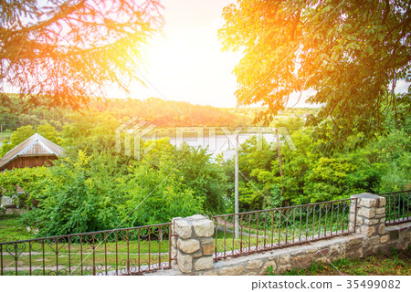 a small lake in the middle of a small village a small lake in the middle of a small village 35499082