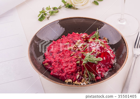 Orzotto from beet, is served with goat cheese with 35501405