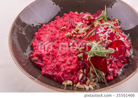 Orzotto with pine nuts and goat cheese, is served Orzotto with pine nuts and goat cheese, is served 35501406