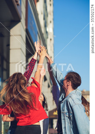 Happy young friends teamwork. 35502174