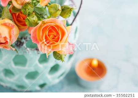 Fresh orange roses flowers in mint vase Fresh orange roses flowers in mint vase 35502251