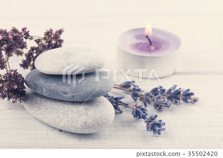 Stack of pebbles, lavender flower Stack of pebbles, lavender flower 35502420