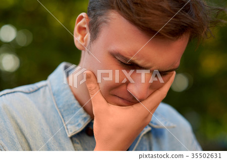 Man with headache, migraine or stress. Man with headache, migraine or stress. 35502631