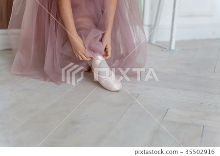 Ballerina puts pointe shoes Ballerina puts pointe shoes 35502916