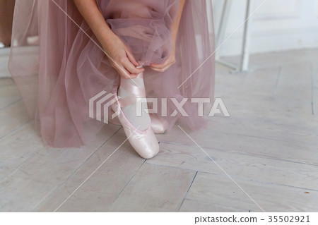 Ballerina puts pointe shoes Ballerina puts pointe shoes 35502921