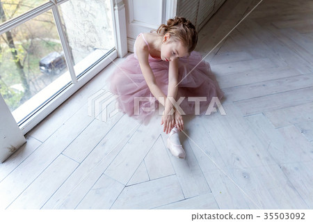 young ballet-dancer sitting on the floor young ballet-dancer sitting on the floor 35503092