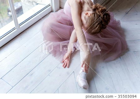 young ballet-dancer sitting on the floor young ballet-dancer sitting on the floor 35503094