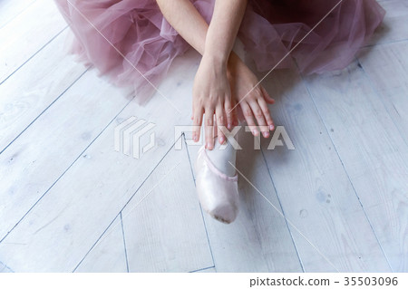 young ballet-dancer sitting on the floor young ballet-dancer sitting on the floor 35503096