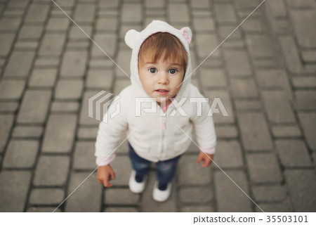 cute little girl in hood with ears cute little girl in hood with ears 35503101
