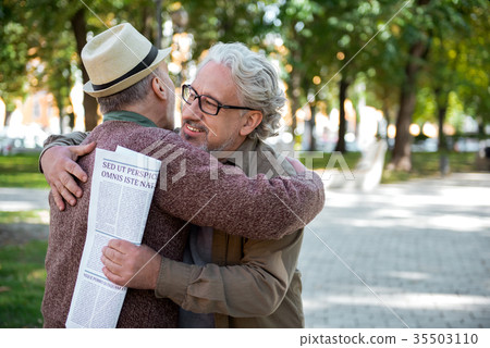 Cheerful senior comrades greeting each other 35503110