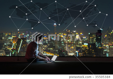 Asian businessman sitting and using the laptop with Network graphic over the world map and cityscape background at night time, Business success and technology concept Asian businessman sitting and using the laptop with Network graphic over the world map and cityscape background at night time, Business success and technology concept 35505384