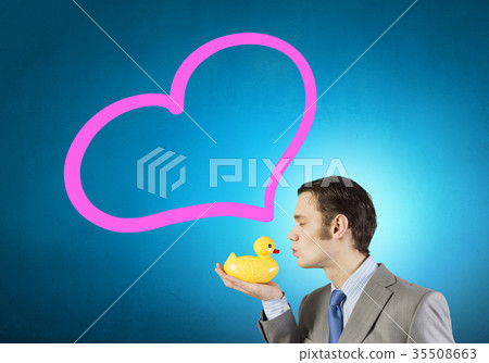 Businessman with duck Businessman with duck 35508663