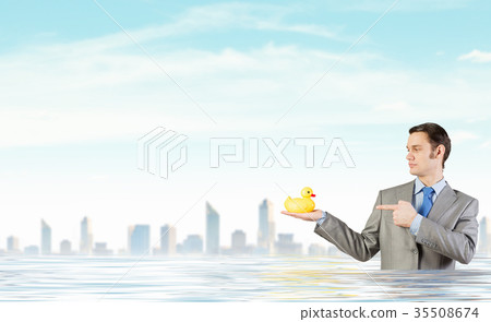 Businessman with duck Businessman with duck 35508674