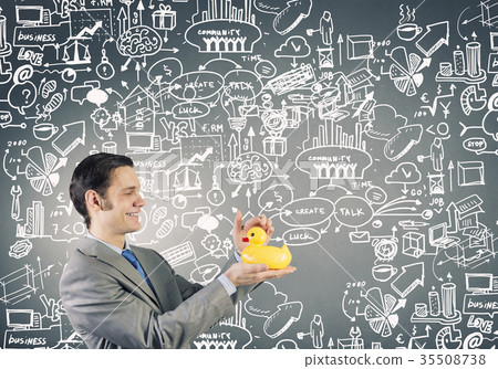 Businessman with duck Businessman with duck 35508738