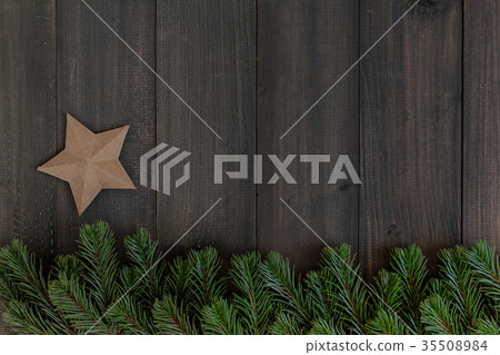 Christmas fir tree branches and paper star Christmas fir tree branches and paper star 35508984