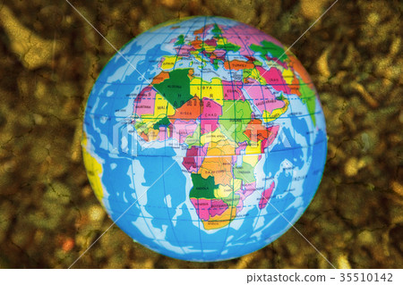 globe on barren and crack soil background. 35510142